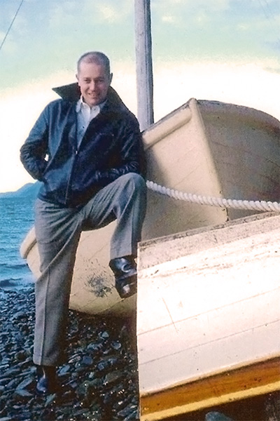 Jim posing on a boat in Alaska